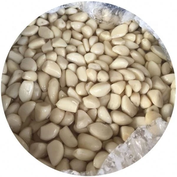Brined white peeled garlic cloves in drums